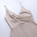 Vestido cruzado con purpurina Carella