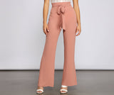 Pantalones acampanados de moda con lazo en la cintura